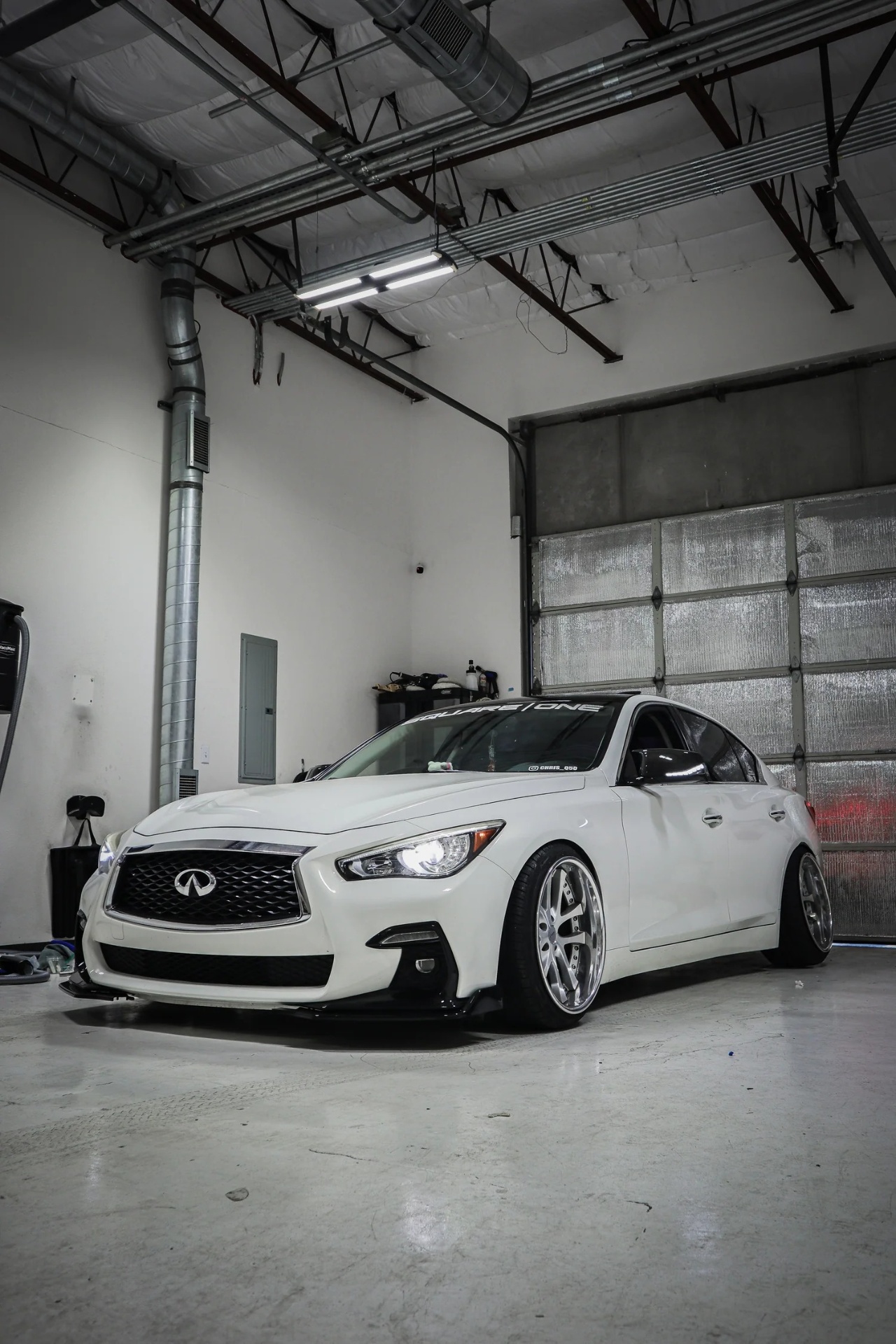 White Infiniti Q50 in the Vertx Wraps shop